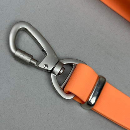 Traílla multipropósito impermeable Naranja