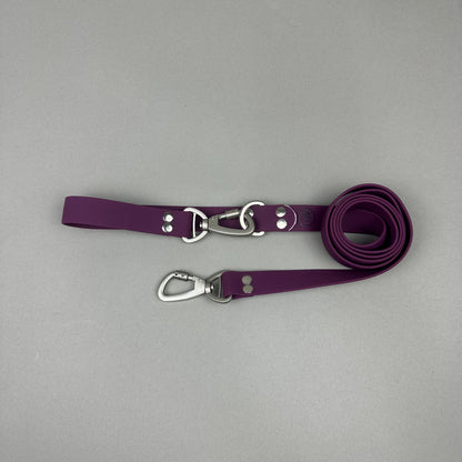 Traílla doble función Impermeable Morado