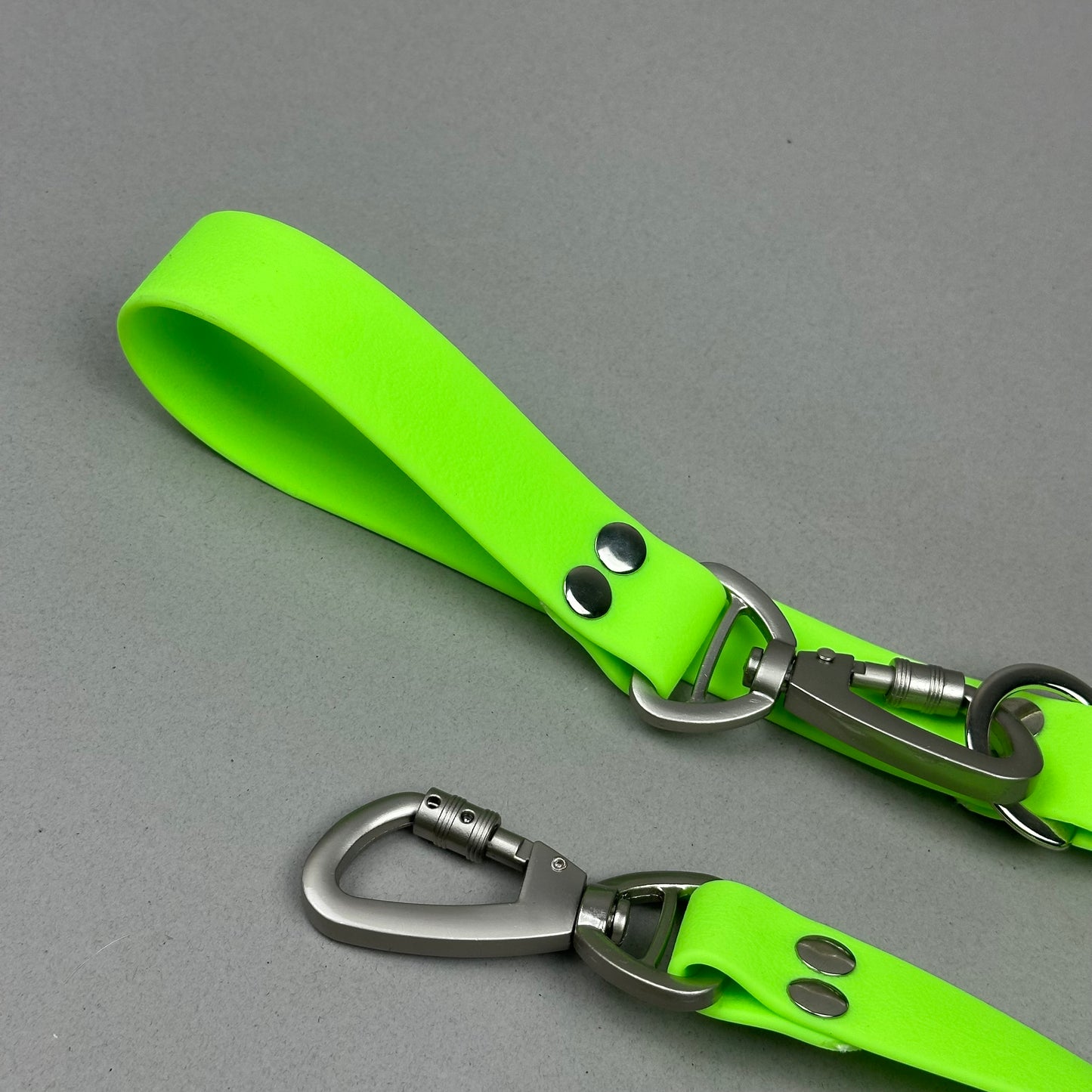 Traílla doble función Impermeable Verde neón