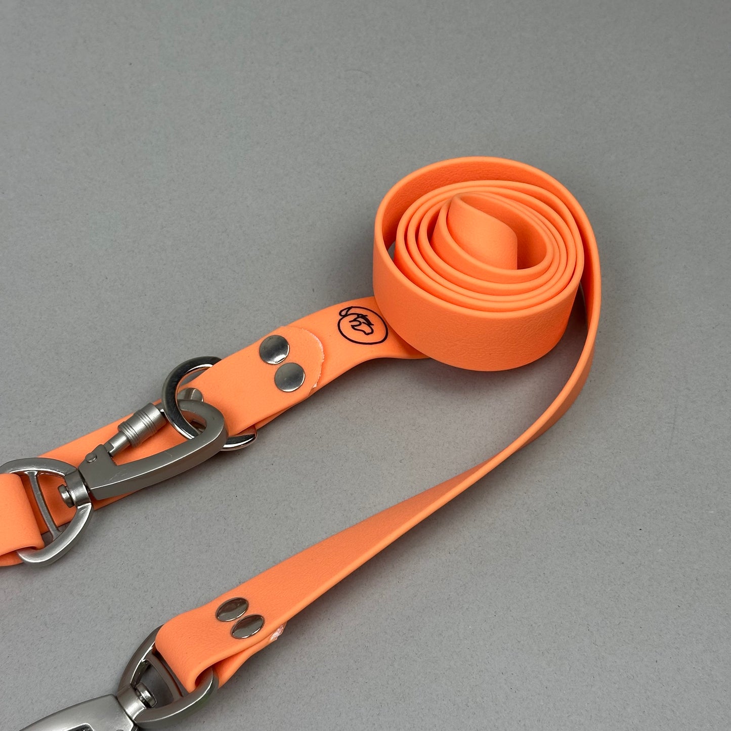 Traílla doble función Impermeable Naranja