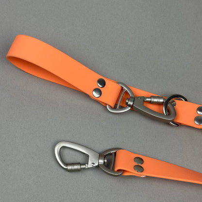 Traílla doble función Impermeable Naranja