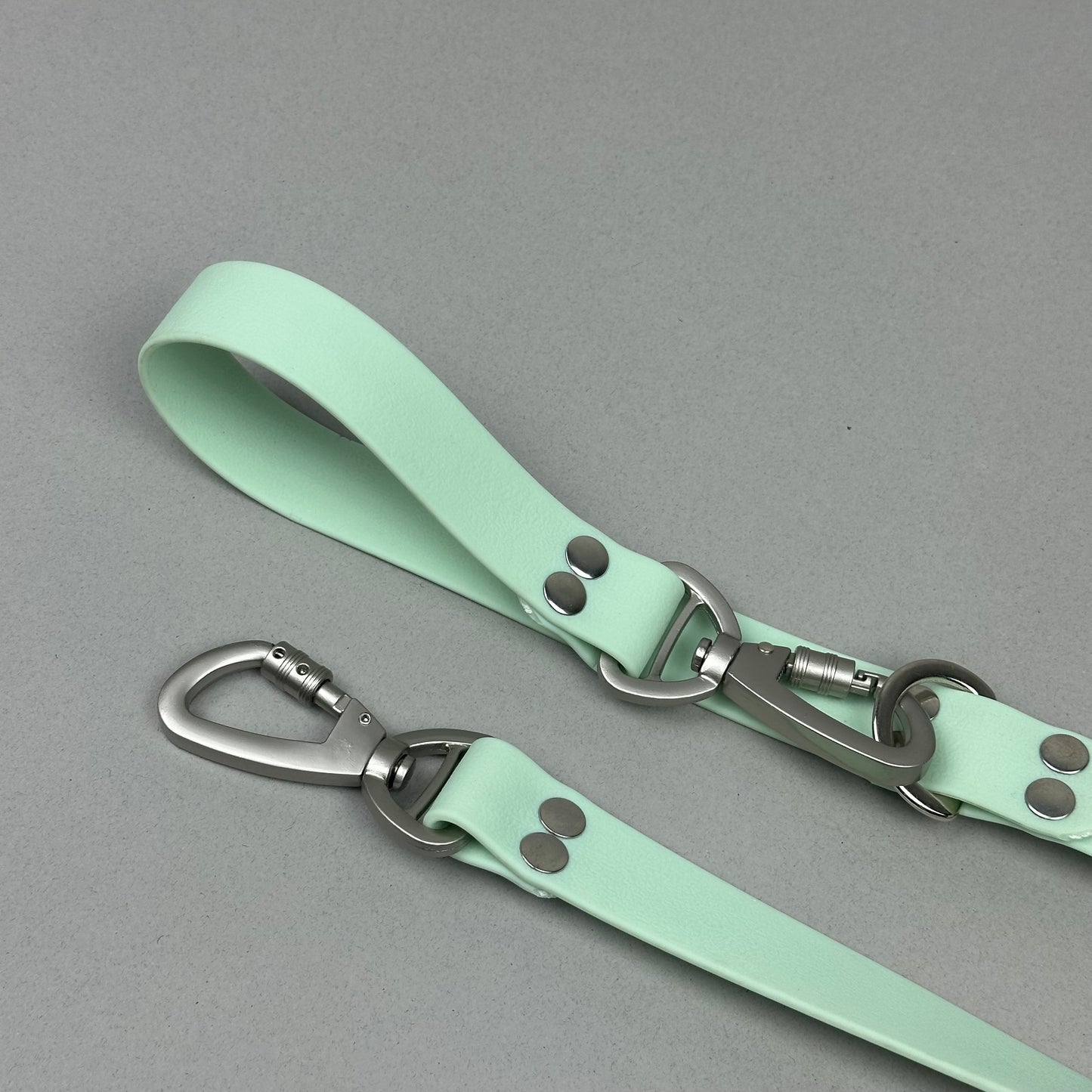 Traílla doble función Impermeable menta