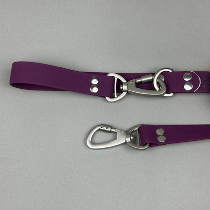 Traílla doble función Impermeable Morado