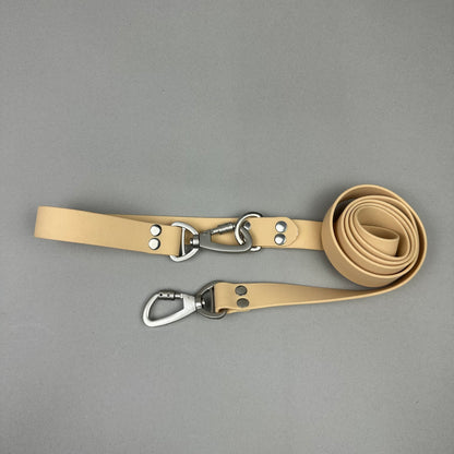 Traílla doble función Impermeable beige