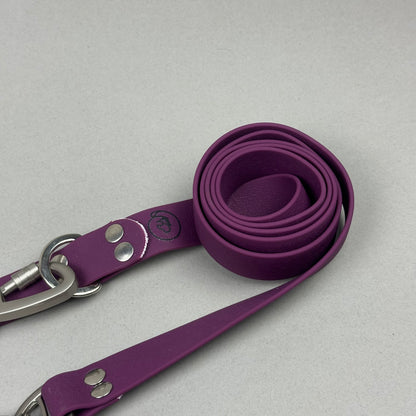 Traílla doble función Impermeable Morado