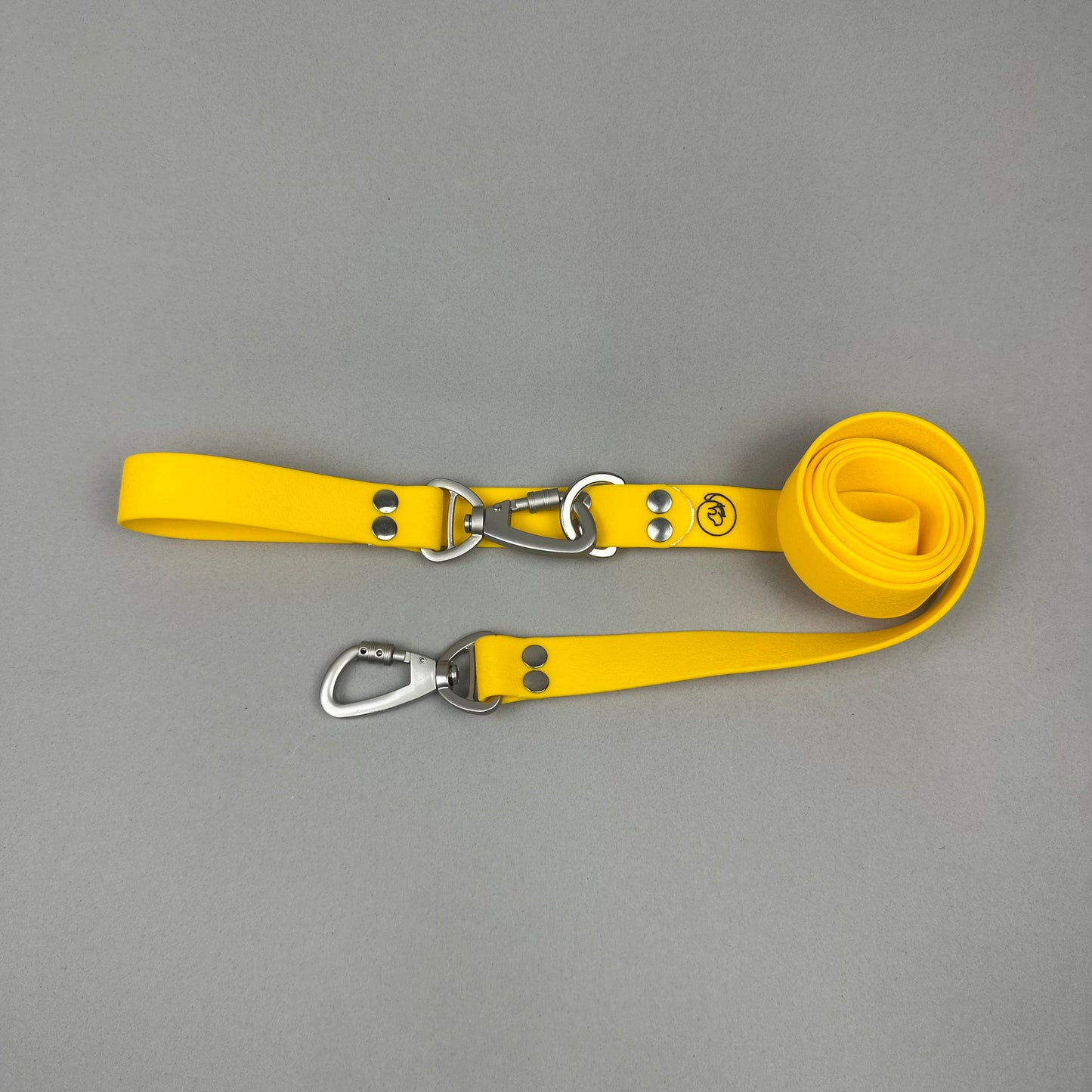 Traílla doble función Impermeable amarillo