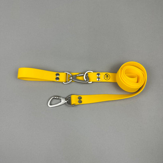 Traílla doble función Impermeable amarillo