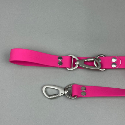 Traílla doble función Impermeable Fucsia