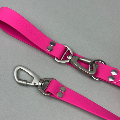 Traílla doble función Impermeable Fucsia