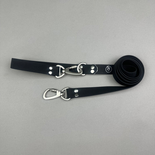 Traílla doble función Impermeable negro